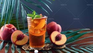 Hình ảnh cốc trà đào nhiệt đới trên lá cây file JPG mẫu số 273